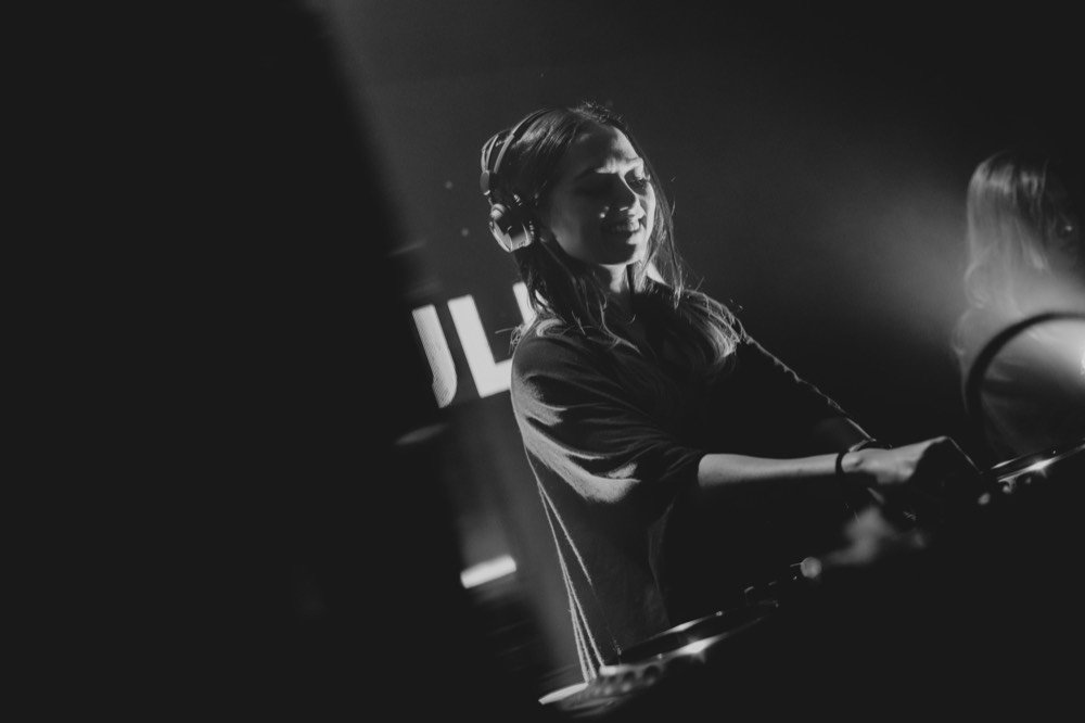 Zouk, Singapore — black-and-white, headphones on, caught mid-set